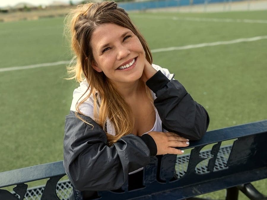 Jacqueline laughing courtside